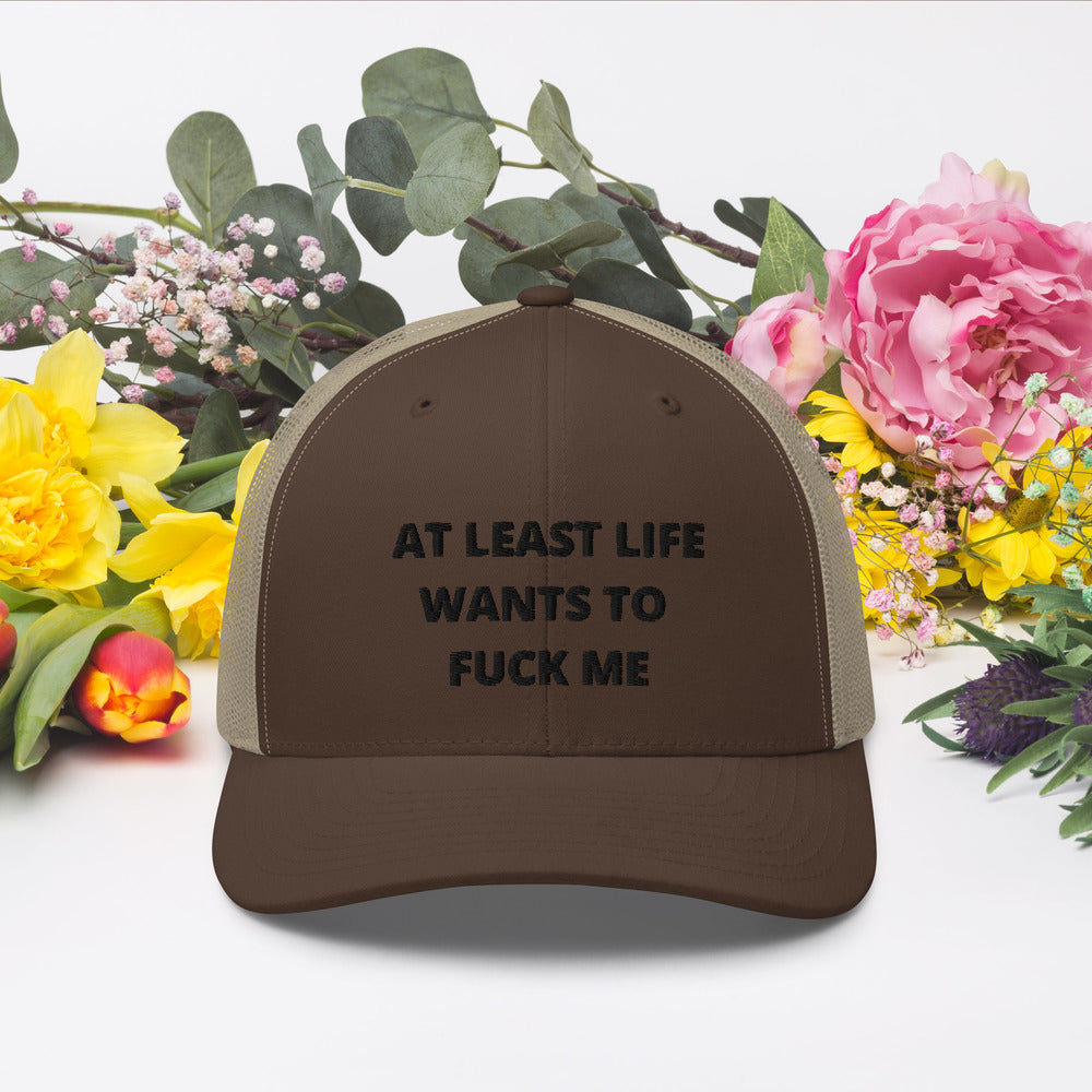 AT LEAST LIFE WANTS TO F*CK ME- Trucker Cap